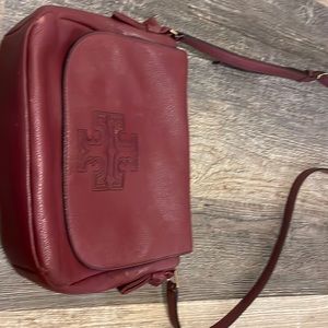 Tory Burch shoulder bag, wine colored pebble leather. Gold trim.